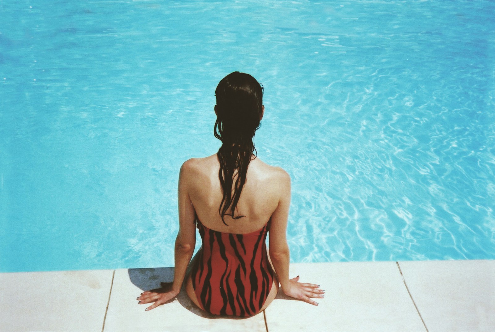Photo by margot pandone woman wearing black and red monokini